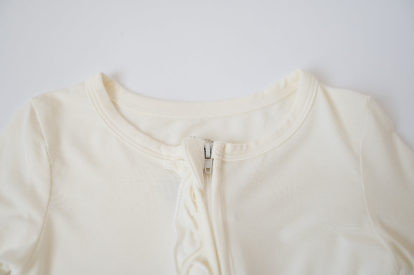 Ruffle Zip | Cloud Dancer